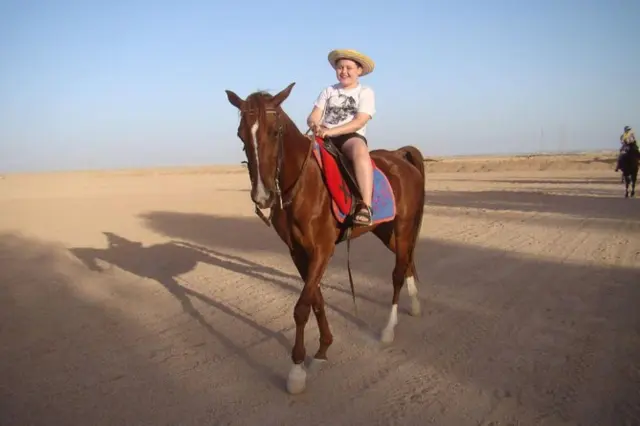 horse riding in desert
