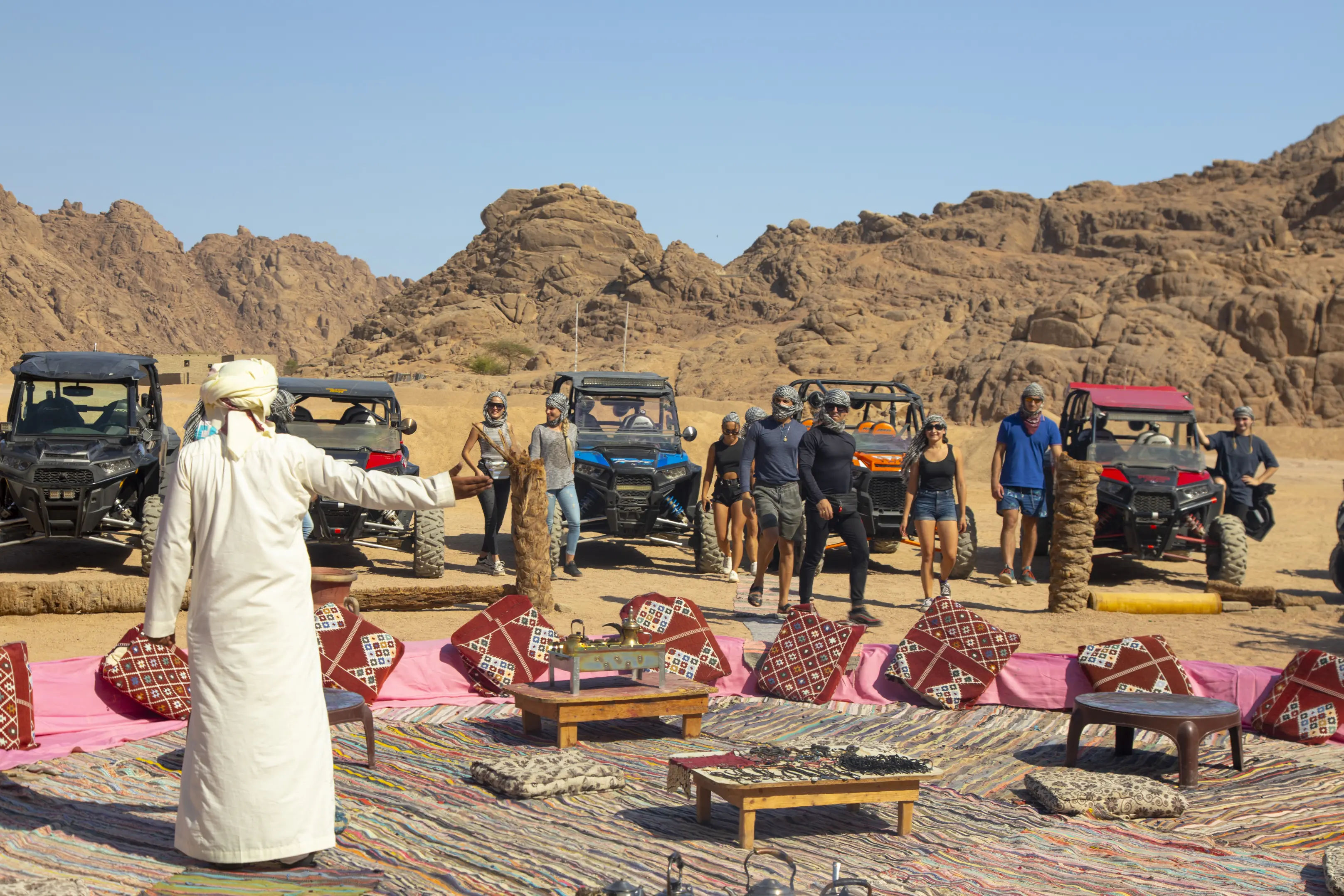 camel riding in desert